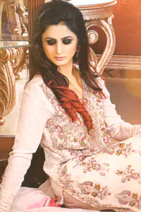 The straight shirt has Resham and other zardozi work with raw silk trousers and a pure crinkle chiffon dupatta. Ivory White Party Wear Kameez Trouser.