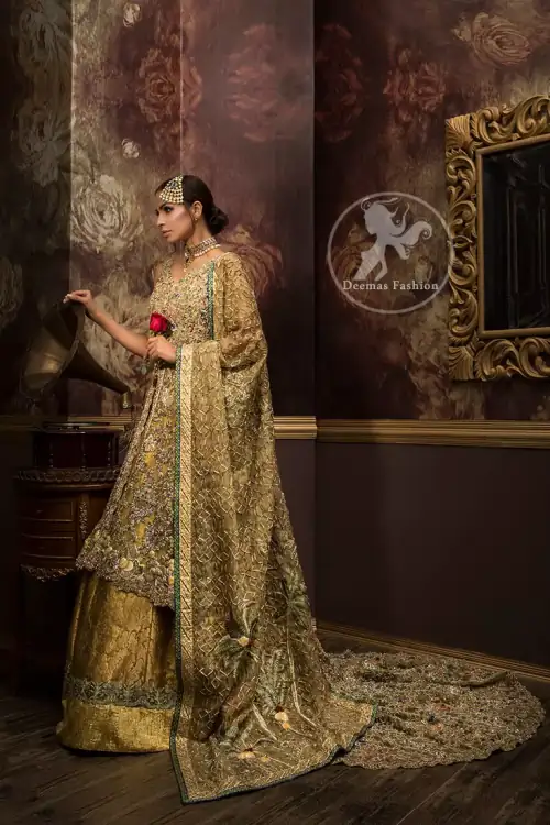 Golden organza lehengha comes with pure crinkle chiffon dupatta having heavy embroidery. Dress comes with front open long back trail