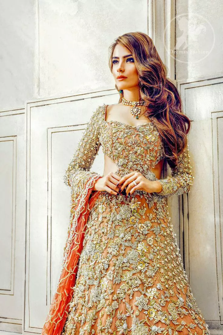 gold asian bridesmaid dresses Epitome of South Asian bridal couture. Indulge in luxury with our intricate  handmade red lehenga from our Jogi bridal collection. Meticulously crafted  for timeless elegance  To book your consultations please WhatsApp +