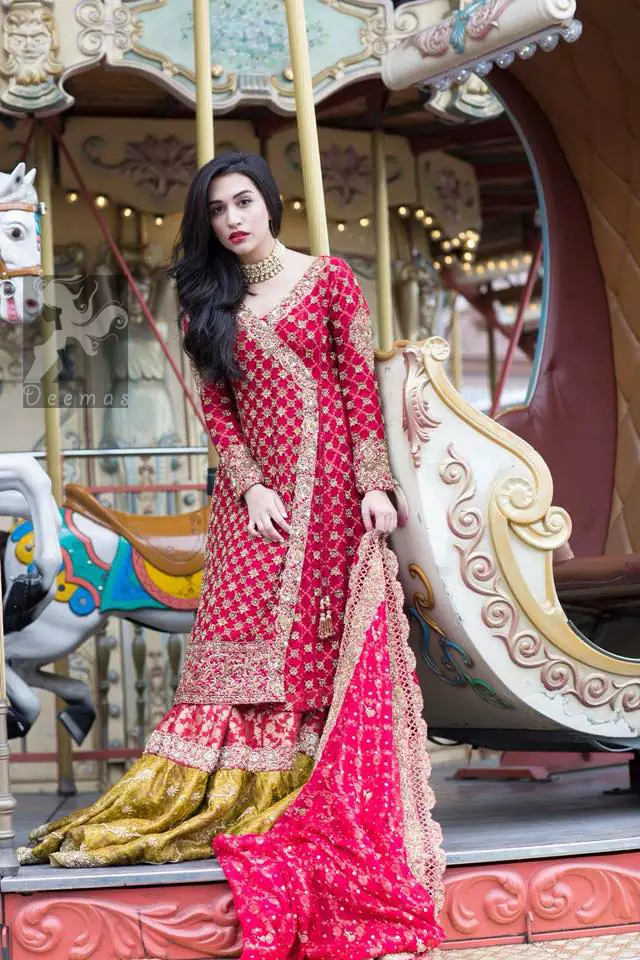 Gown adorned with dull golden and antique shades of embellishment. Pure banarsi chiffon jamawar dupatta having embellished border and small motifs spray. Pure banarsi chiffon jamawar gharara in Cardinal Pink and Mehndi Green.