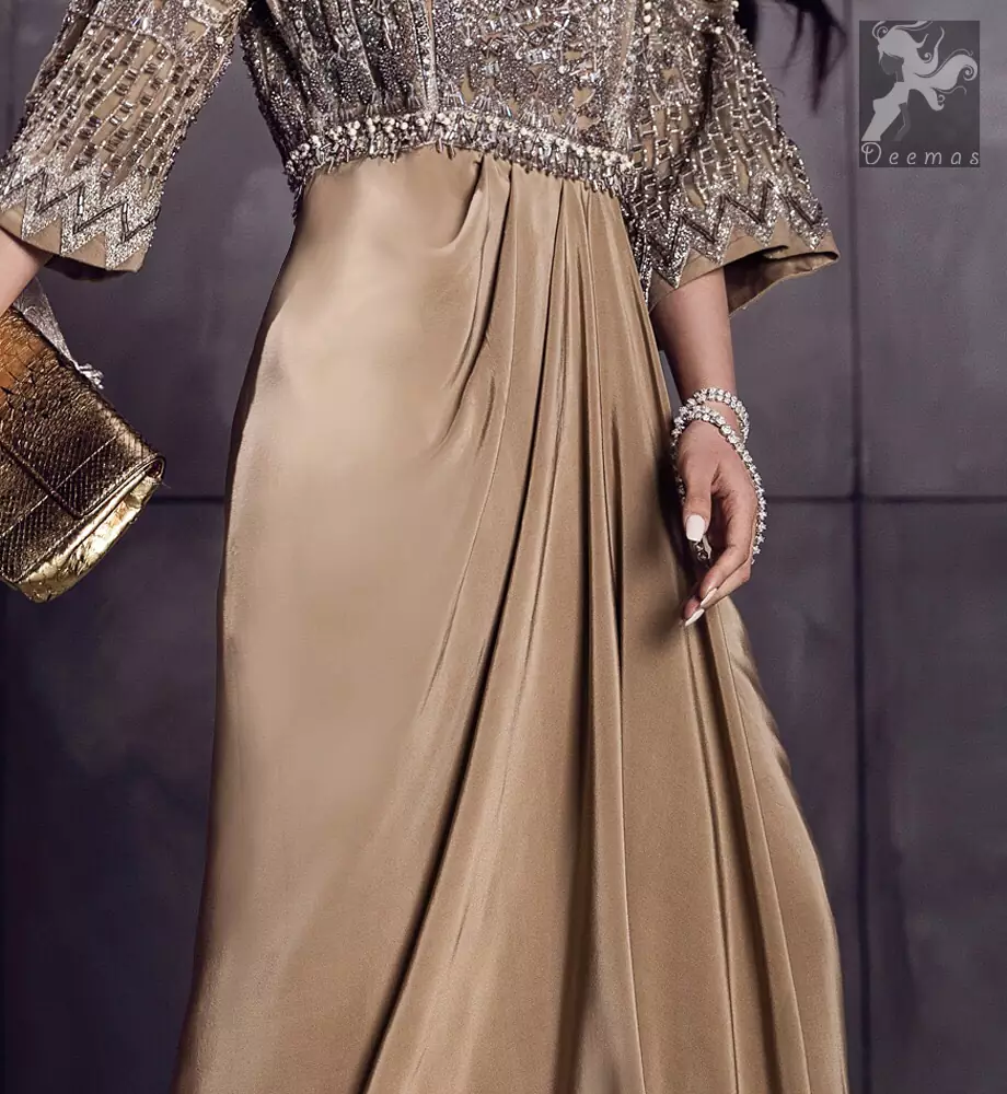 Fawn brown silky maxi has embellished bodice and sleeves. Bodice and sleeves have been embellished with dark gray embellishment and ivory pearls. 