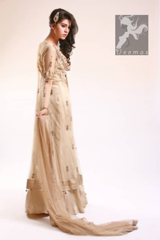 Fawn Blouse adorned with antique gold and brown embellishment. Fawn pure crinkle chiffon gown center slits border has been adorned with light embellishment border and follows small motifs and sequins spray all over it. Pure crinkle chiffon sharara and dupatta has sequins spray all over it.
