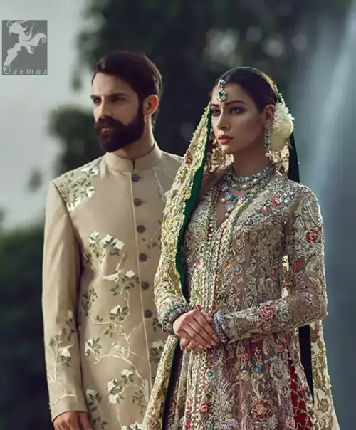 Light fawn pure crinkle chiffon front slits gown adorned with beautiful colorful embellishment. Red lehengha adorned with embellishment all over