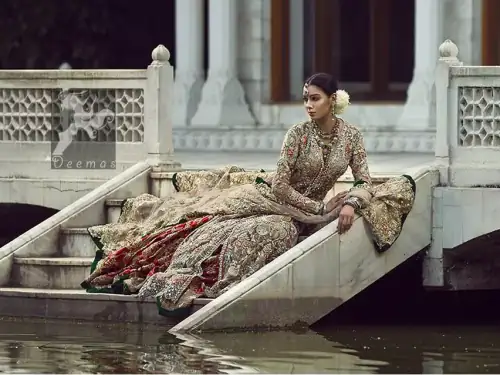 Light fawn pure crinkle chiffon front slits gown adorned with beautiful colorful embellishment. Red lehengha adorned with embellishment all over