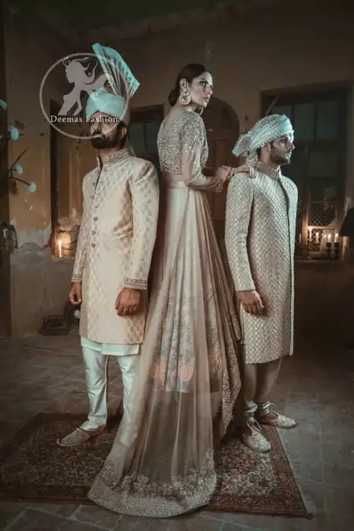 Ivory floor length Anarkali embellished with floral embroidery. Front and back bodice is fully embroidered with dull golden and antique