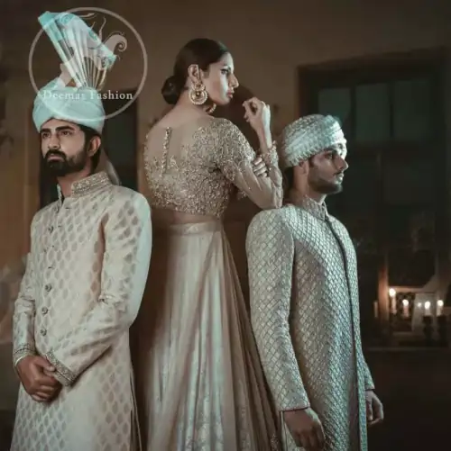 Ivory floor length Anarkali embellished with floral embroidery. Front and back bodice is fully embroidered with dull golden and antique