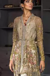This open short frock is decorated with Resham thread, kora, dabka, tilla, sequins and pearls. It is self embroidered shirt embellished with floral thread embroidery. It is further enhanced with an embroidered scalloped border which adds to the look. It comes with pants. It is beautifully coordinated with a chiffon dupatta which is sprinkled with sequins all over.