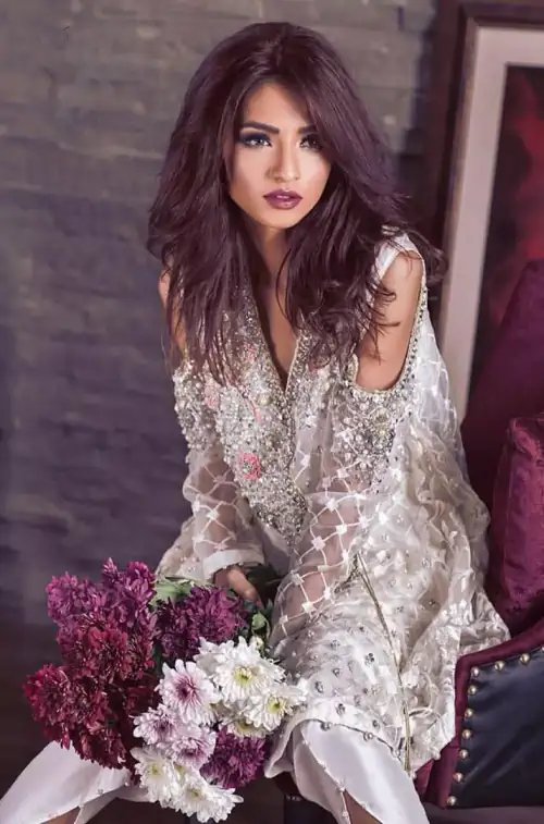 This beautiful angrakha style shirt adorned with embroidered featuring silver and antique shaded kora dabka, tilla, sequins and swarowski. Hemline