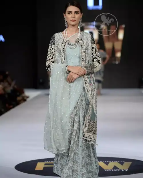This outfit is a timeless beauty. The blouse is covered with gown embellished with silver gold kora dabka, Sequins and