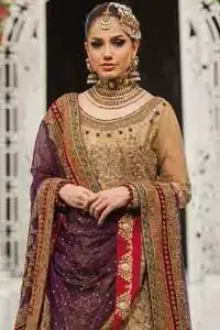 This bridal dress is perfect for your special day. Exude elegance in this chiffon shirt finessed with beautiful embellished daman and neckline, done with antique shaded kora dabka, tilla, sequins and pearls. Lehenga comprises of floral embroidery adorned with thick embellished border. It comes with purple dupatta with embroidered borders on all sides and sequins spray on the ground.