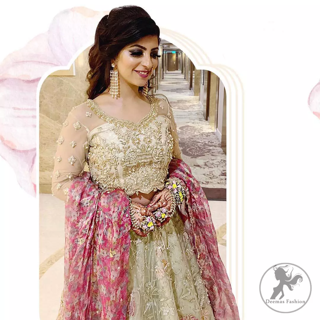This dress is adorned with floral embroidery, highlighted with kora, dabka, tilla, sequins and pearls. It is allured with intricate embroidered motifs and detailed bodice. Blouse is scalloped. The border on hemline is enhanced with embellished floral pattern detailing, that instantly draws attention.It comes with embellished net lehengha with brocade lining. It is artistically coordinated with net dupatta which is allured with four sided border.