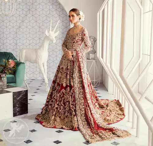 Look alluring in this floor length frock embellished with kora dabka, tilla, swarovsky and pearls. It has intricate embroidered motifs