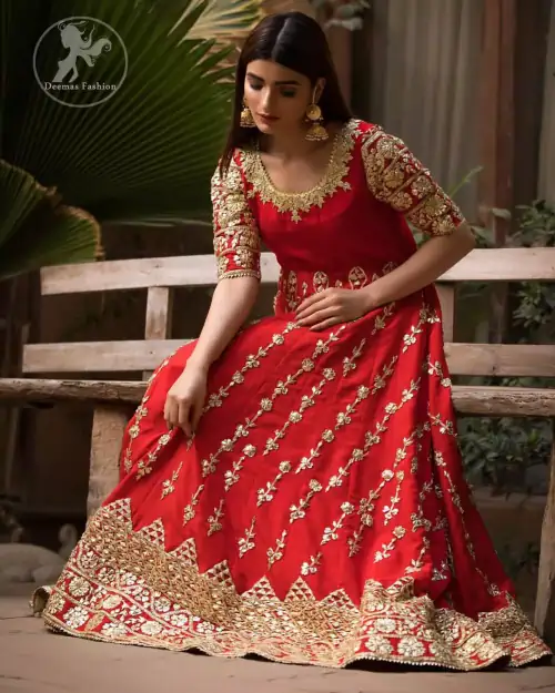 Exude elegance and class in this anarkali frock finessed with beautiful hand crafted embellishment. Embellished neckline and three quarter sleeves