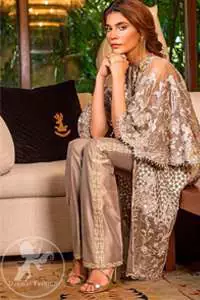 Bring out your beauty with this traditional yet modern thread embroidered gown decorated with embellished floral motif and swarovski crystals and pearls. Furthermore it is enhanced with scalloped border embellished with floral thread embroidery and complete the look with pearls ending. It comes with straight trousers embellished with lace. It is coordinated with chiffon dupatta which is sprinkled with sequins all over it.