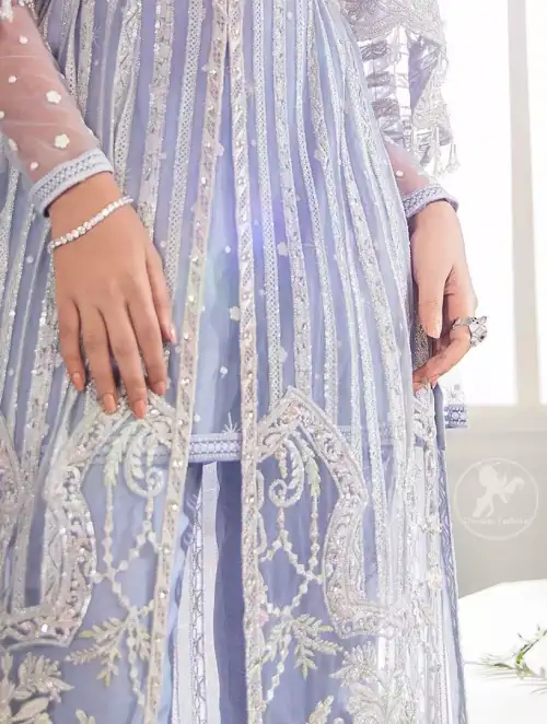 Steal the moment with our cold purple floor length gown emphasized with traditional neckline and intricate floral daaman enhanced with