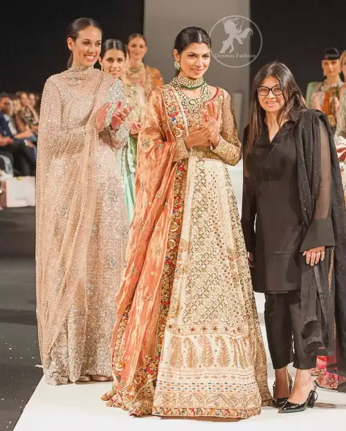 This dress is beautifully decorated with heavy embroidery. It is highlighted with dull golden kora, dabka, tilla, sequins and pearls.