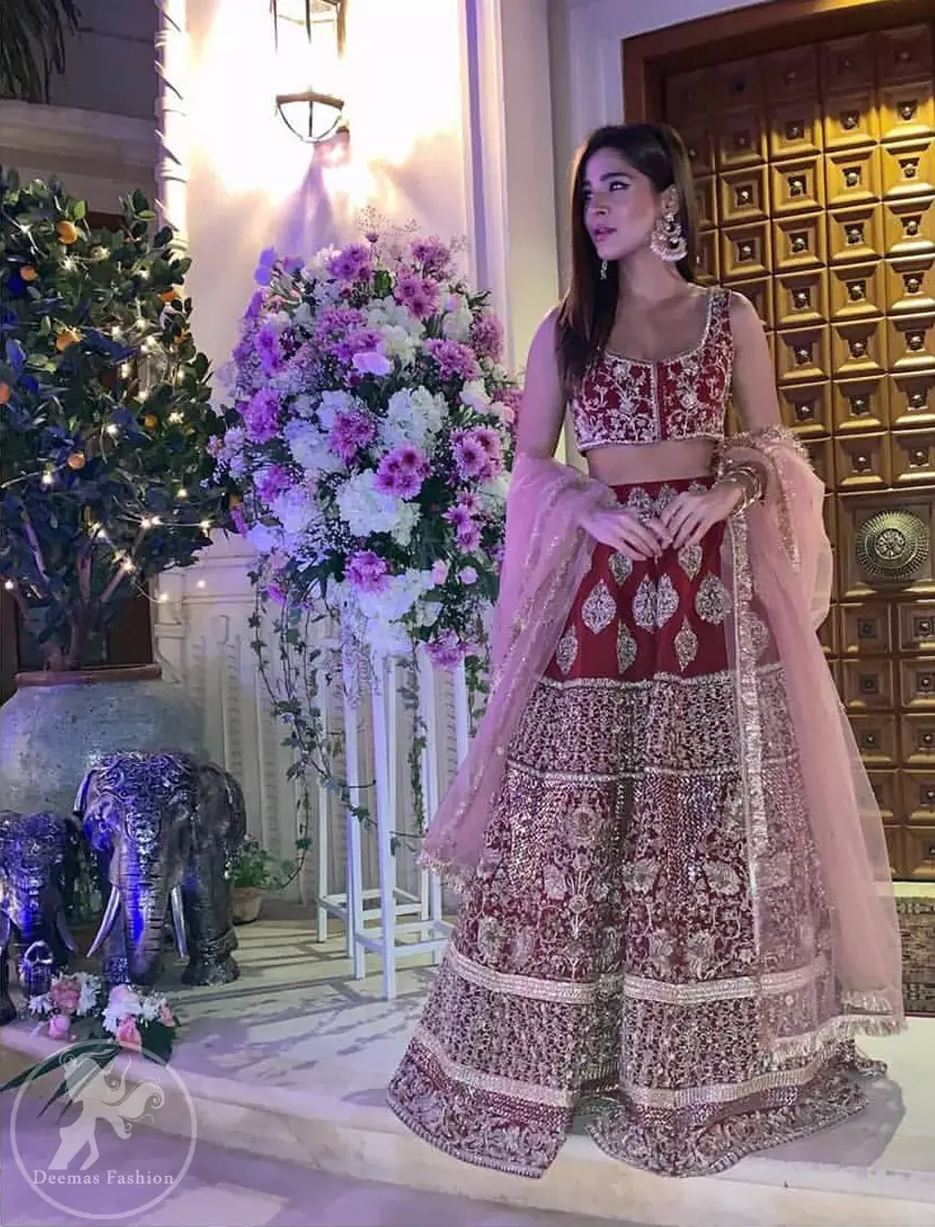 Steal the moment with our sepia brown blouse skirt emphasized with traditional embroidery and intricate floral embellishment enhanced with gold kora, dabka and sequins. It comes with heavy embellished lehenga which emphasized with different motifs and floral embroidery. It is coordinated with tissue dupatta which is sprinkled with sequins all over it.