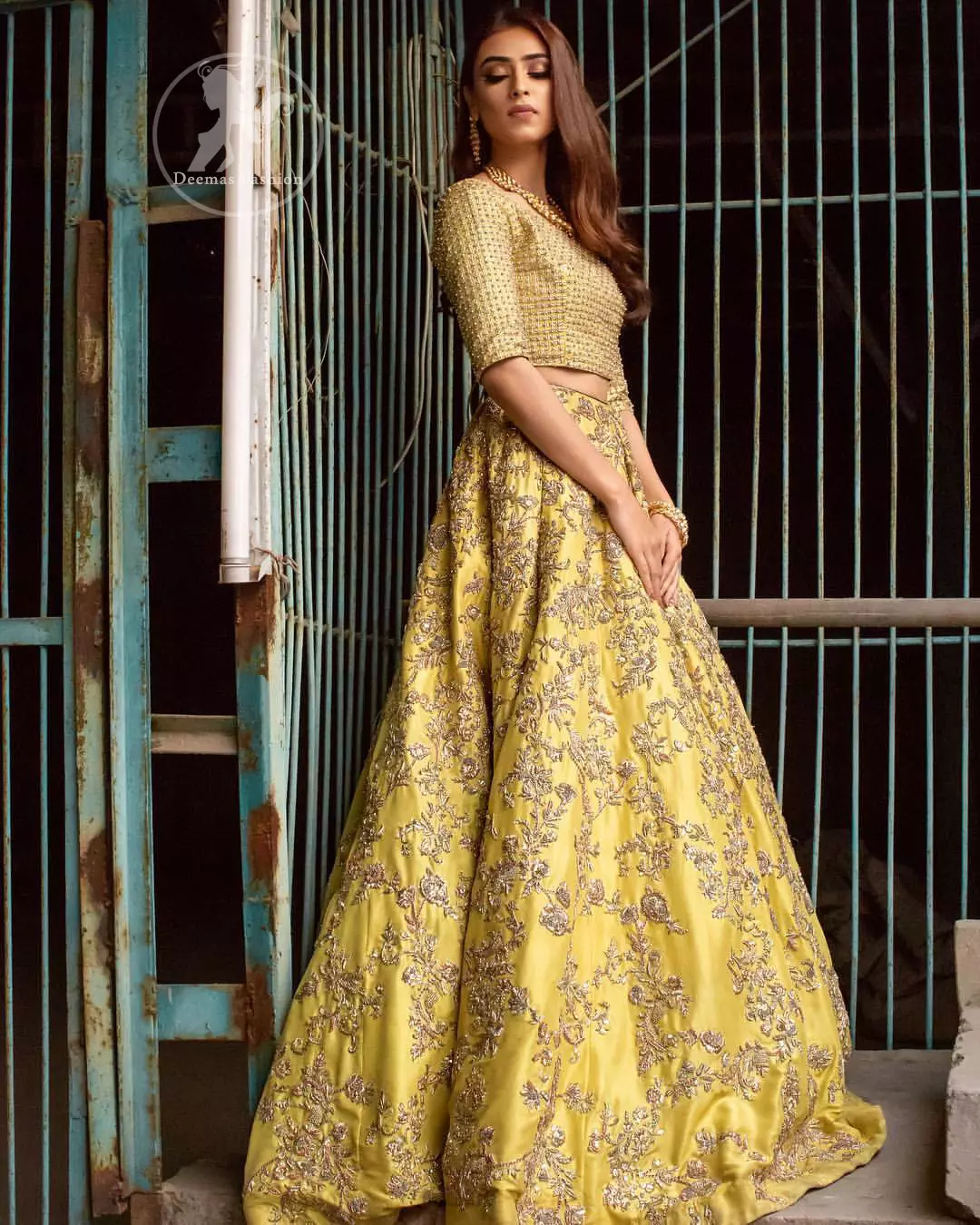 Tradition meets modernity. Exhibit elegance in this yellow blouse lehengha enhanced with kora and dabka embroidery adorned with Swarovski crystals and zardozi is perfect ensemble for mehendi. The outfit is coordinated with tissue dupatta with hand embroidered borders on all four sides and zardozi sequins work on the ground. It comes with raw silk fully embroidered lehengha.