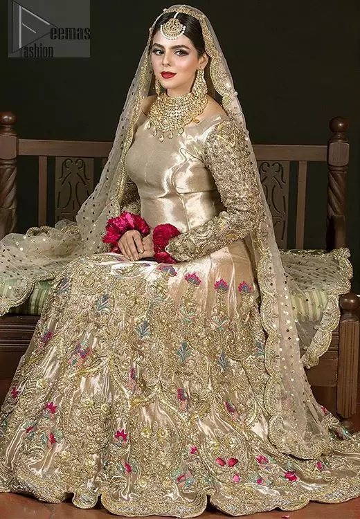 The antique brass lehenga is an example of remarkable handiwork. With a lot of attention to detail, the intricate sequencing, kora, dabka embellishment and multiple color thread embroidery makes this outfit look like nothing but a dream. The floor kissing asymmetrical lehenga add to its charm. Elegance is personified when it gets paired up with beautiful embroidered dupatta with sequins spray all over and embellished scalloped border datailing.