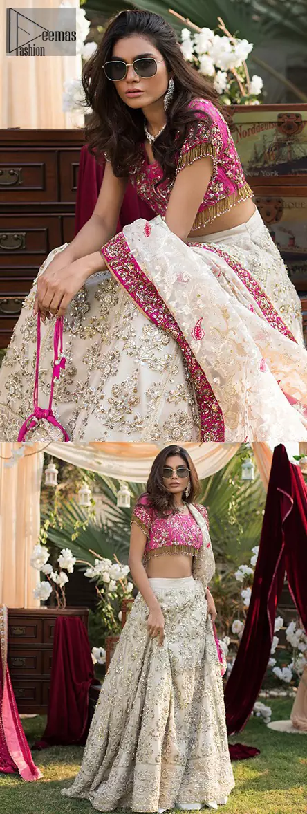 This dress id perfect for Reception or Nikah day. The bridal stands out due to its uniqueness and the perfect fusion of modern cut and traditional embroidery. Make your big day more interesting with this shabby chic statement intensified with rich zardosi work all over the front and bold patterns at daaman. The blouse is fully embellished with champagne and antique shaded embroidery all over and finishing with tassels. The outfit is beautifully coordinated with self printed dupatta adorned with shocking pink embellished applique on all four sides.