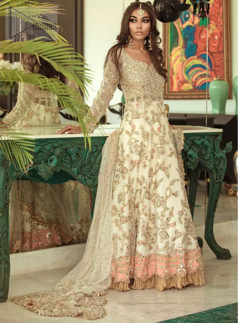 Reflecting exuberant color play in this ethereal piece meticulously highlighted with antique shaded kora, dabka, tilla and sequins. The frock is delicately crafted with floral bunches, fully embellished bodice and scalloped applique daman to give it a perfect ending. The contemporary yet traditional embroidered stripes on the sleeves completes the look. The outfit is comprises with mustard crushed sharara. It is paired with ivory chiffon dupatta with sequins chann all over and two sided embroiderd pallu.