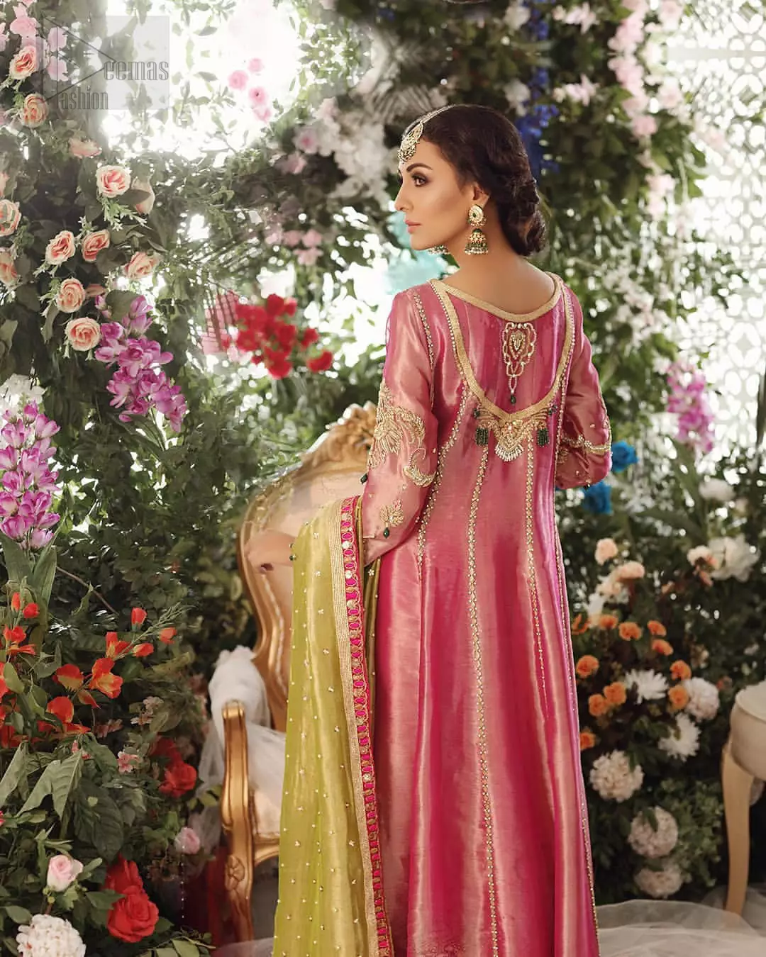Nothing speaks of femininity and class louder than this mehndi outfits for bridesmaids. This beautiful mehndi dress comes with anarkali frock with beautiful embellished motifs around the scalloped hemline and vertically worked gold lines and heavily embellished neckline with light golden, champagne and antique shaded zardozi work. It comes with sharara adorned with colored floral embroidery with champagne embellishment. Complete the look with parrot green dupatta having four sided applique borders and sequins spray on the ground.