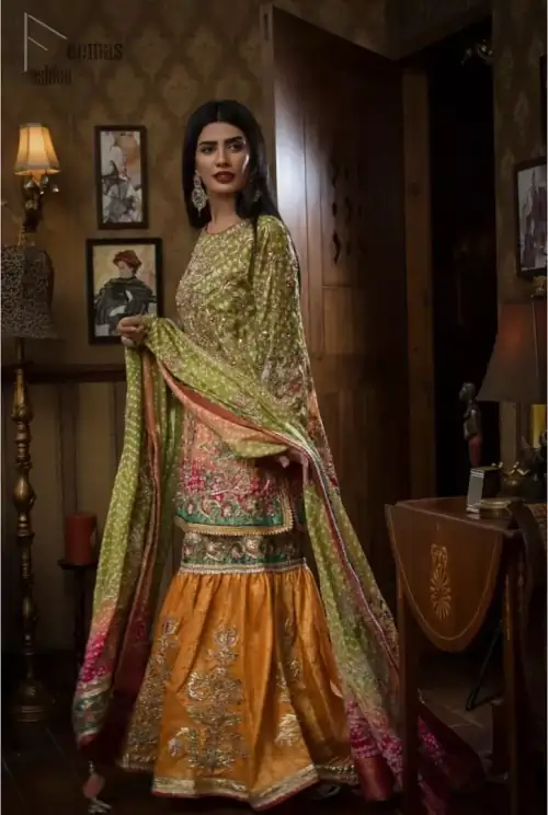 Brighten up your look with this beautiful mehndi dress comes with a beautiful parrot green shirt. This shirt is adorned