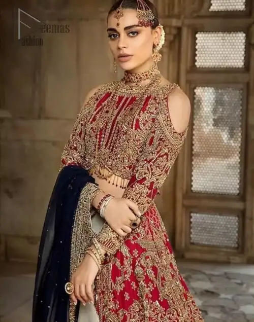 A breathtaking red traditional lehenga paired with a detailed blouse, equally alluring make for an ensemble which is comfortably chic.