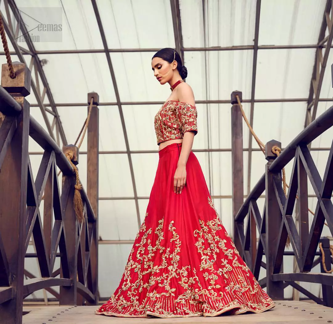 Captured in traditional silhouette, The bridal stands out due to its uniqueness and the perfect fusion of modern cut and traditional embroidery. This dress is beautifully decorated with heavy embroidery. It is highlighted with kora, dabka, tilla, sequins and pearls. Off shoulder blouse is enhanced with zardosi work all over. It comes with full embellished lehenga adorned with floral booties and vertical lines all over it. It is coordinated with net dupatta which is sprinkled with sequins all over it. It is further furnished with four sided embellished border.