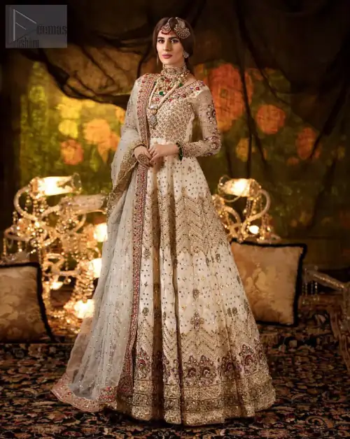 Delicately crafted and personifying chic elegance with an element of grandiose. This outfit is beautifully sculptured with geometric embroidery, adorned