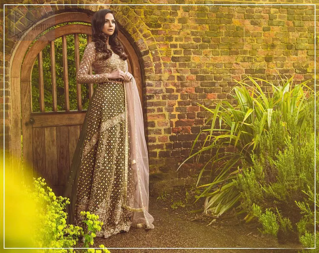 Nothing speaks of femininity and class louder than this mehndi outfits for bridesmaids. The motifs on the mehndi lehenga for a wedding are a true example of decorative and ornamental expression stylized in a contemporary way. The chic yet elegant mehndi green lehenga is decorated with zardozi embellished vertical lines, geometric patterns adorned with gotta work and floral bunches. Borders are even more enhanced with detailed motifs and finished with scallops. The blouse is fully decorated with floral embroidery all over with zardozi work in the shades of golden and antique. The look is completed with organza dupatta with embroidered lace borders and sequins spray all over.