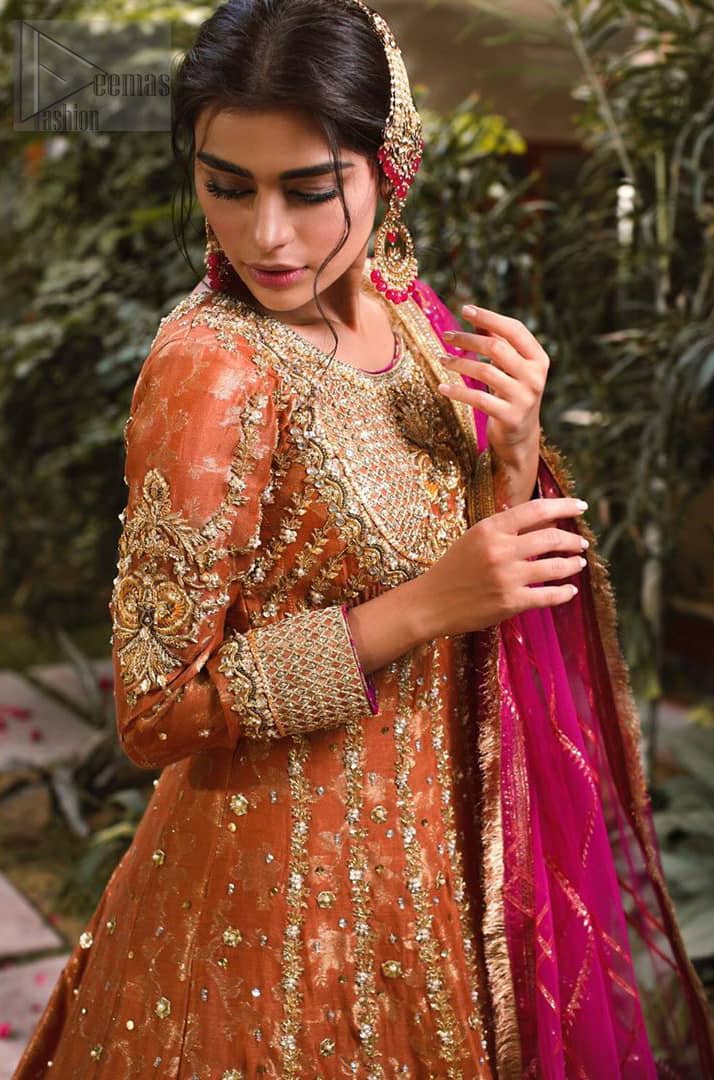 Let the crowd stare and make it worth their while when you walk wearing this anarkali frock. Designed to flaunt your best features, the bodice carries intricate zardozi work. Furthermore this multiple panel frock is enhanced with gota work and beautiful applique on bottom embellished with golden kora, dabka, tilla, sequins and beads work. Pair it up with pink churidar pajama and pink organza dupatta emphasized with gota work and four sided kiran lace. Upholding the idea of simple is beautiful, you would definitely want to wear this for your next occasion.