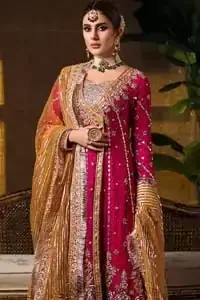 Impeccably on trend. The chic yet elegant front open angrakha style frock is decorated with vertical embroidered lines, embellished neckline and floral bunches. Borders are even more enhanced with rust applique details done with golden and light golden zardozi work. It comes with brocade rust sharara exaggerated with embroidered pink applique on the bottom. Elegance is personified when it gets paired up with rust dupatta decorated with four sided kiran lace and zardozi work on all four sides.