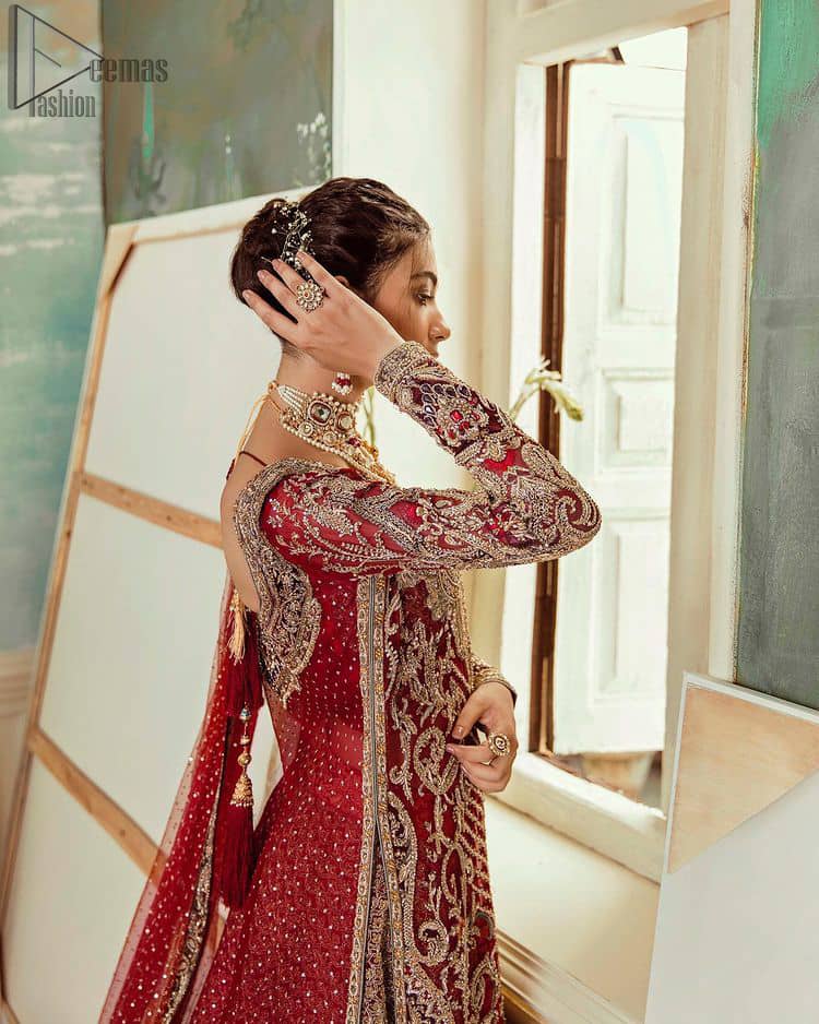 Deep red jacket gown having inner velvet blouse with maroon back train lehenga and heavily embroidered dupatta.