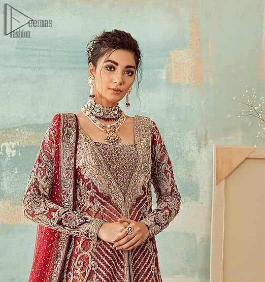 Deep red jacket gown having inner velvet blouse with maroon back train lehenga and heavily embroidered dupatta.