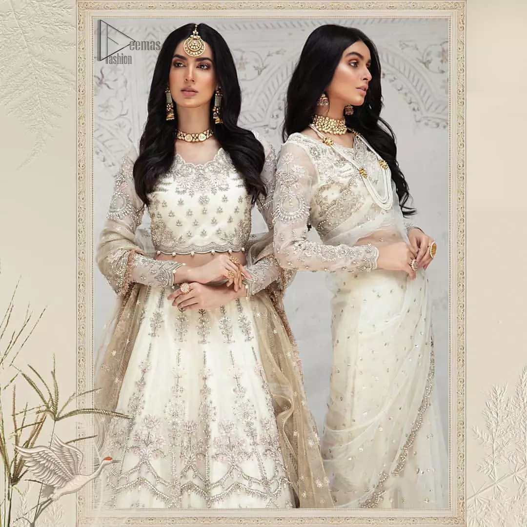 Designed with great expertise, the Ivory Blouse Lehenga is going to set you on a heavenly journey, full of comfort, merriment and unlimited beauty. In a professional sense of full sleeves, the dress is laudable for its majestic light golden and silver embroidery under the very meritorious round neckline. To contribute towards its eminence, this bridal wear is made with the finest organza. A lehenga and an exquisite net dupatta make this marvellous attire a paragon of extreme beauty on your Walima.