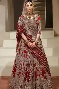 Crafted with love. This dress is classically designed to make your memorable day beautiful as it should be. This handcrafted remarkable ensemble reflects the aura of the heavenly blouse and includes art deco design elements. A wedding ensemble from the house of DeemasFashion in which the intricate detailing makes all the difference. A delicate arrangement of hand-embellished floral patterns with zardozi work makes the skirt more attractive. Complete the look with a maroon organza dupatta adorned with four-sided embellished borders and tiny floral motifs scattered all over the ground.