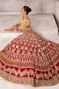 Discover classic red and fawn dresses for a traditional style, with delicate detailing and intricate accents for a subtle yet sophisticated look, including long-sleeves laden with zardozi work. The blouse is beautifully sculptured with floral embroidery, also adorned with cutwork, embellished with silver kora dabka, pearl and sequins work all over. Complement the look with a red lehenga emphasized with different sizes of floral motifs, geometric pattern and heavy embellished bottom with zardozi work is absolutely breathtaking. The outfit is to pair up with a red dupatta with hand embellished border and floral motifs all over.