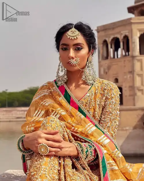 Presenting the Mustard Angrakha Frock, a charming Mehndi wear that will enhance your stunning personality to a whole new level.