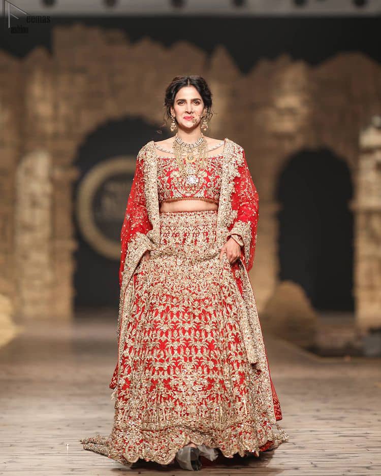 Pakistani Wedding Wear having Red Short Blouse Lehenga. The dress is designed in full sleeves to add more to its grace.