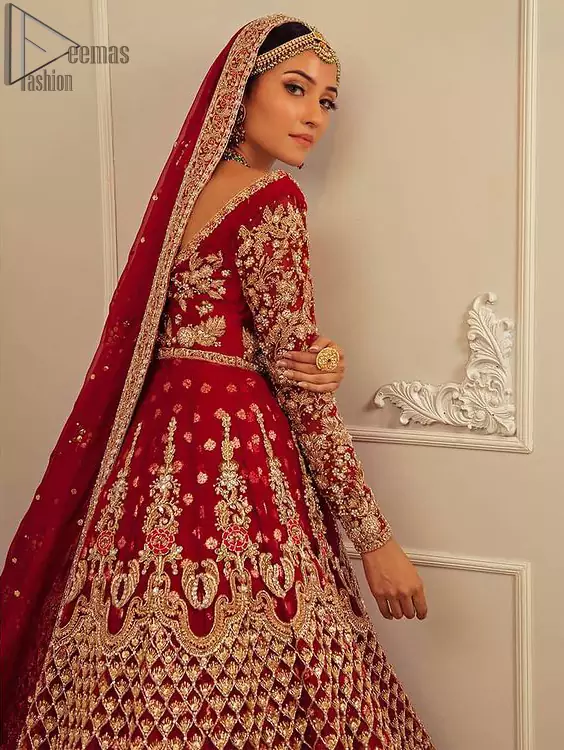 Make your moment memorable being a queen in red lehenga pishwas intensified with voguish sleeves and geometric patterns. This dreamy pishwas is adorned with an embellished bodice and finished with embroidered scallop border all around which gave a perfect ending to this flare. Lehenga is artistically adorned with tiny motifs all over the ground. Finish the look with a red accentuated lehenga having four-sided embellished borders and sequins spray all over the ground. Making it true that you can turn all the heads around with your gorgeous ability to wear the outfit in a way that is spectacular.