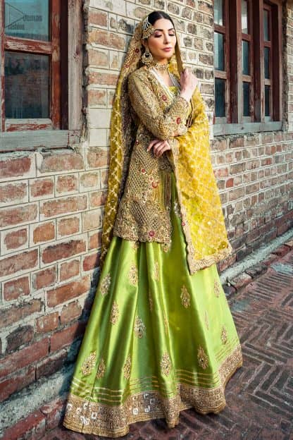 The traditional style of bridal wear always appears the most fascinating. Once worn with confidence, this admirable bridal wear will make you an embodiment of true beauty on your Mehendi Mayon. Bright Green Lehenga Blouse – Front Open Shirt.