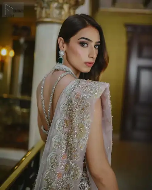 This ravishing attire follows a stunning blouse, a graceful lehenga and a touch of perfection with a dupatta, all made