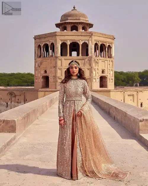 the dress with a tissue dupatta and graceful palazzo pants makes you the center of attention on your big day. Peach