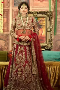 A little blend of the traditional and western styles doubles the gorgeousness of the Red Short Shirt Lehenga. A dress with such dexterity that it holds the magic towards a gorgeous wedding day. Its can-can style and cultural styled full-sleeves are indeed a contribution to the overall exceptional beauty of the dress. Purest organza as the most graceful as well as the comfortable fabric is chosen by our professional designers for this highly ravishing attire. As per the dress's need, a boat-shaped neckline appears admirable, while the exceptional work of golden embroidery assures you of the lots of attraction you'll receive on your Reception day.