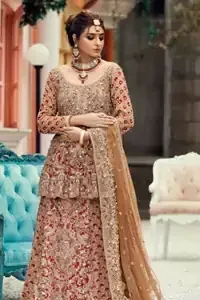 Red Lehenga Peplum, a fine full-sleeved bridal wear speaks for its prevailing beauty and unparalleled charm. It features a highly remarkable back train and is decorated with fascinating criss-cross patterns. charming as it is, the very exquisite dress code includes a mesmerizing organza peplum, a gorgeous organza lehenga and not to forget, the traditional touch with a net dupatta. A dexterous work of silver and golden embroidery work as the icing on the cake, making you even more admirable. Our designers made sure, you look like a South-Asian queen on your reception day.