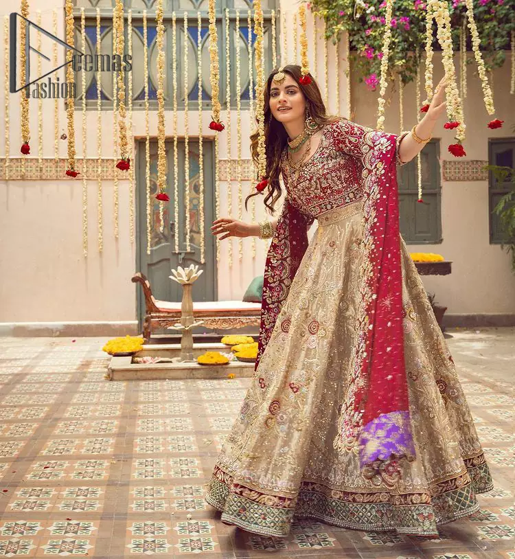 It's distinctive how the new-gen brides are welcoming red and beige shades for their bridal outfits as well. So Welcome your guest to this charming beige lehenga. The three quarter-sleeved Red Blouse got it all for you. In addition to this, the Beige lehenga has embellished border embroidery and floral embroidery in dabka, kora work that gives the stunning look. Furthermore, it is enhanced with embroidered applique bottom. The organza red dupatta that has a scalloped applique border all around the edges makes the look complete and comprehensive.