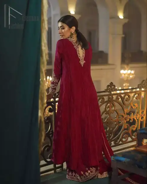 A picture of pure elegance with maroon crushed frock enhanced with embellished golden embroidered neckline. The neckline is adorned with