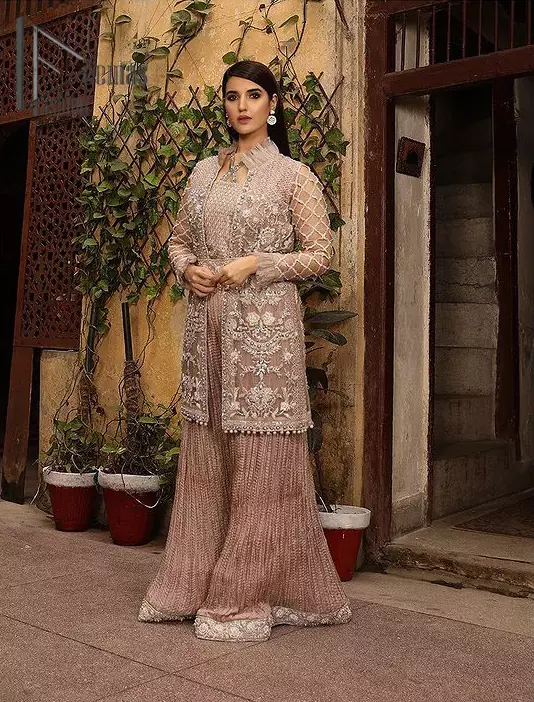 Nothing spells magic quite like a tea rose outfit on your big day. An engrossing shirt and crushed sharara style provide unparalleled majesty and impressiveness to the overall dress code all made with the purest of the tissue. This tea rose full sleeve shirt is heavily embellished with silver embroidery that includes pearls, kora and dabka work. Our attire and the way we put ourselves together sometimes speaks louder than our words. So, we set it up with tea rose crushed sharara to balance the magical fairytale look.
