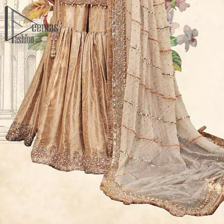 Opt for a versatile outfit for your Nikkah that is the perfect amalgamation of splendid colours, deluxe fabrication, and exquisite profile as well. Satiate your soul with extraordinary ensembles from this fawn short shirt gharara of DeemasFashion outfits. The round neckline of the short shirt is just amazing when combine with full sleeves. Further, it is highlighted with antique embroidery that includes tilla, kora, and dabka work. Pair up it with fawn gharara made with pure Katan banarsi jamawar fabric just to grant you a super aesthetic look. Complete this outfit with a fawn dupatta that is embellished with a four-sided embellished border and kiran lace as well.